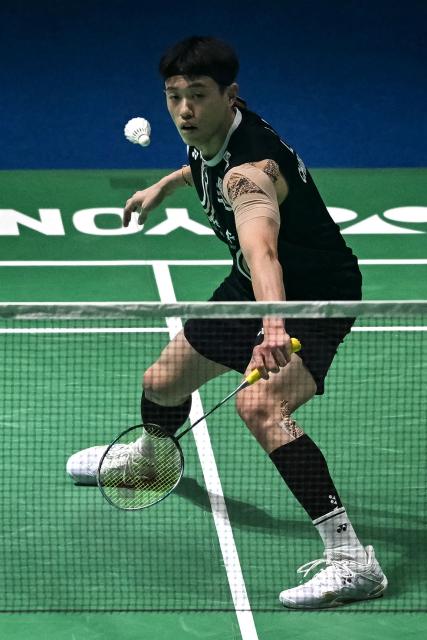 Taiwan’s Lin Chun-yi hits a return during his men's singles final match against Indonesia’s Jonatan Christie at the India Open 2026 badminton tournament in New Delhi on January 18, 2026. (Photo by Sajjad HUSSAIN / AFP)