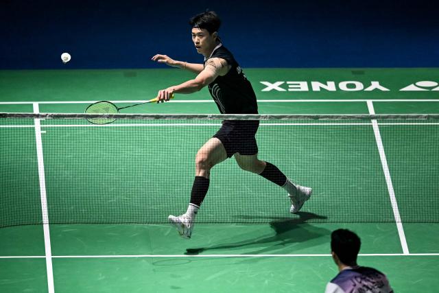 Taiwan’s Lin Chun-yi hits a return during his men's singles final match against Indonesia’s Jonatan Christie at the India Open 2026 badminton tournament in New Delhi on January 18, 2026. (Photo by Sajjad HUSSAIN / AFP)