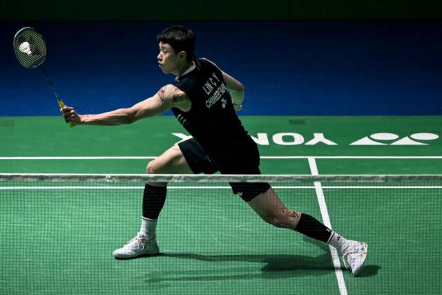 Taiwan’s Lin Chun-yi hits a return during his men's singles final match against Indonesia’s Jonatan Christie at the India Open 2026 badminton tournament in New Delhi on January 18, 2026. (Photo by Sajjad HUSSAIN / AFP)