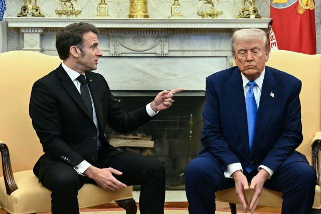 (FILES) US President Donald Trump meets with French President Emmanuel Macron in the Oval Office of the White House in Washington, DC, on February 24, 2025. France's President Emmanuel Macron, who will be "in contact with his European counterparts throughout the day", will call for the "activation of the EU's anti-coercion instrument" if Donald Trump's threats of customs surcharges are carried out, his entourage said on January 18, 2026. (Photo by Jim WATSON / AFP)