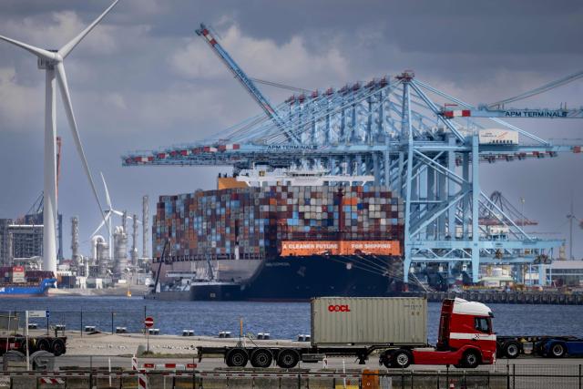 (FILES) A photo shows containers and transshipment at Maasvlakte, an industrial area in the port of Rotterdam, on July 21, 2025. France's President Emmanuel Macron, who will be "in contact with his European counterparts throughout the day", will call for the "activation of the EU's anti-coercion instrument" if Donald Trump's threats of customs surcharges are carried out, his entourage said on January 18, 2026. (Photo by Robin van Lonkhuijsen / ANP / AFP)