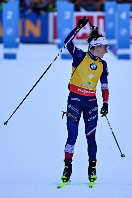 France's Lou Jeanmonnot-Laurent reacts as she crosses the finish line to win the women's Pursuit competition of the IBU Biathlon World Cup in Ruhpolding, southern Germany on January 18, 2026. (Photo by Tobias SCHWARZ / AFP) / ALTERNATIVE CROP