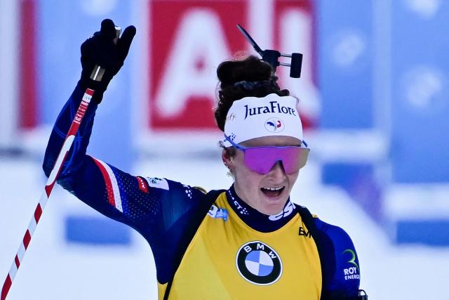 France's Lou Jeanmonnot-Laurent reacts as she crosses the finish line to win the women's Pursuit competition of the IBU Biathlon World Cup in Ruhpolding, southern Germany on January 18, 2026. (Photo by Tobias SCHWARZ / AFP) / ALTERNATIVE CROP