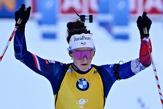 France's Lou Jeanmonnot-Laurent reacts as she crosses the finish line to win the women's Pursuit competition of the IBU Biathlon World Cup in Ruhpolding, southern Germany on January 18, 2026. (Photo by Tobias SCHWARZ / AFP) / ALTERNATIVE CROP