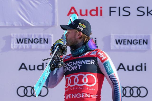 Norway's Atle Lie McGrath celebrates on the podium after winning the men's slalom race of the FIS Alpine Skiing World Cup in Wengen, on January 18, 2026. (Photo by Dimitar DILKOFF / AFP)
