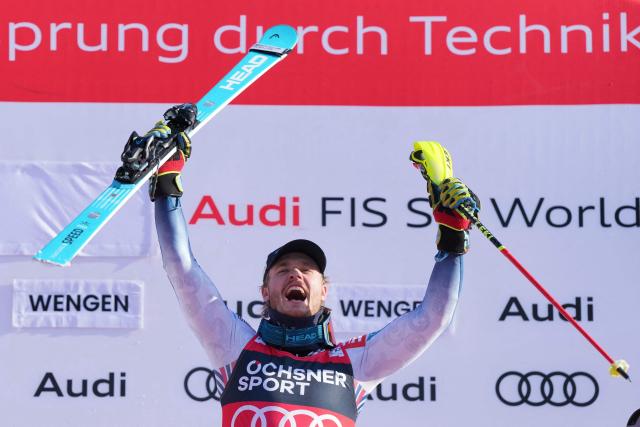 Norway's Atle Lie McGrath celebrates on the podium after winning the men's slalom race of the FIS Alpine Skiing World Cup in Wengen, on January 18, 2026. (Photo by Dimitar DILKOFF / AFP)