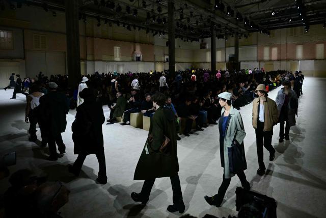 Models walk the runway during the Prada collection show as part of Men's Fall/Winter 2026-2027 Milan's fashion week, on January 18, 2026. (Photo by Stefano RELLANDINI / AFP)