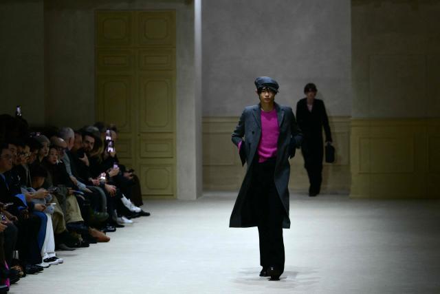 A model walks the runway during the Prada collection show as part of Men's Fall/Winter 2026-2027 Milan's fashion week, on January 18, 2026. (Photo by Stefano RELLANDINI / AFP)