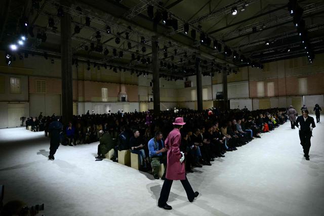 Models walk the runway during the Prada collection show as part of Men's Fall/Winter 2026-2027 Milan's fashion week, on January 18, 2026. (Photo by Stefano RELLANDINI / AFP)