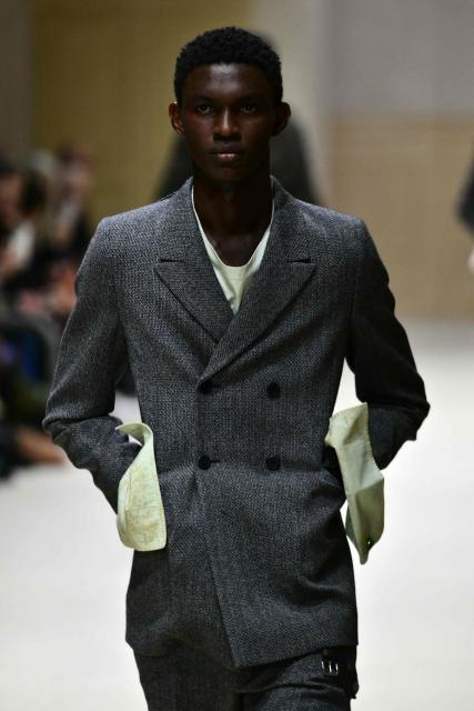 A model walks the runway during the Prada collection show as part of Men's Fall/Winter 2026-2027 Milan's fashion week, on January 18, 2026. (Photo by Stefano RELLANDINI / AFP)