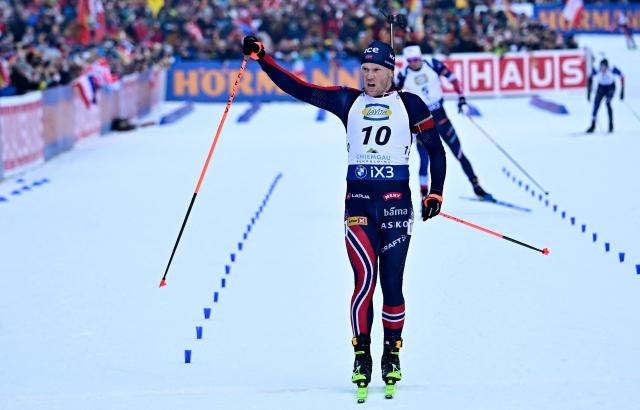 Norway's Johannes Dale crosses the finish line to win the men's Pursuit event of the IBU Biathlon World Cup in Ruhpolding, southern Germany on January 18, 2026. (Photo by Tobias SCHWARZ / AFP)