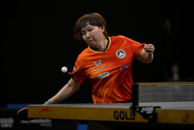 Macoa's Zhu Yuling hits a return against Japan's Hitomi Sato during the final's of the Woman's World Table Tennis (WTT) Star Contender tournament at the Lusail Sports Areana, in Doha on January 18, 2026. (Photo by Mahmud HAMS / AFP)