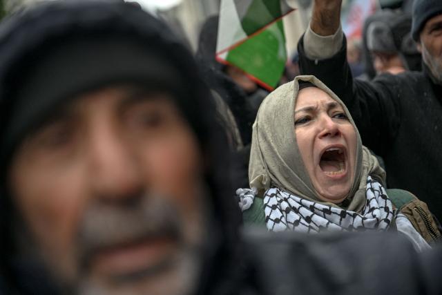 A protester shouts slogans against the US and Israel during a pro-Iranian regime demonstration in front of the Iranian consulate in Istanbul, on January 18, 2026. Iranian authorities have said they are considering "gradually" restoring internet access after imposing an unprecedented communications shutdown 10 days ago, which rights groups say masked a violent protest crackdown that killed thousands. Demonstrations sparked in late December by anger over economic hardship exploded into protests widely seen as the biggest challenge to the Iranian leadership in years. (Photo by Ozan KOSE / AFP)