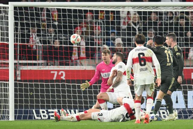Union Berlin's South Korean midfielder #11 Jeong Woo-yeong (2nd R) scores the 1-1 goal past Stuttgart's German goalkeeper #33 Alexander Nuebel during the German first division Bundesliga football match between VfB Stuttgart and Union Berlin in Stuttgart, southern Germany, on January 18, 2026. (Photo by THOMAS KIENZLE / AFP) / DFL REGULATIONS PROHIBIT ANY USE OF PHOTOGRAPHS AS IMAGE SEQUENCES AND/OR QUASI-VIDEO