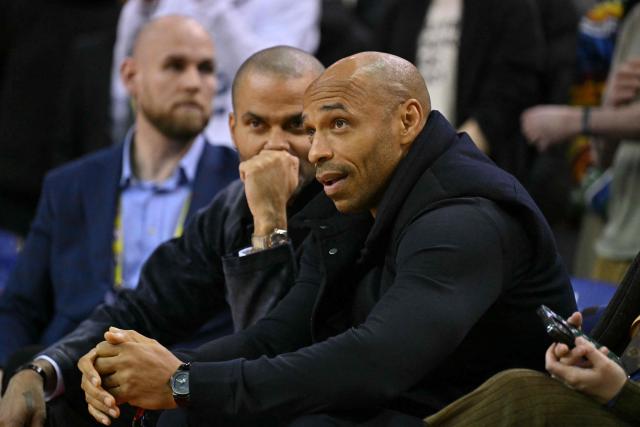 France's former footballer Thierry Henry is his seat for the 2025/2026 NBA season basketball match between the Memphis Grizzlies and Orlando Magic at the O2 Arena in London on January 18, 2026. (Photo by Glyn KIRK / AFP)