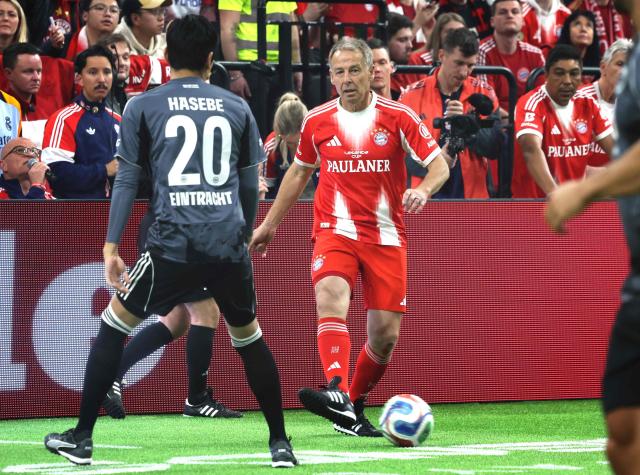 Former Bayern Munich player Juergen Klinsmann controls the ball during the Legends Cup in the SAP Garden in Munich, southern Germany on January 18, 2026. (Photo by Karl-Josef HILDENBRAND / AFP)