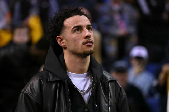 Liverpool footballer Curtis Jones attends the 2025/2026 NBA season basketball match between the Memphis Grizzlies and Orlando Magic at the O2 Arena in London on January 18, 2026. (Photo by Glyn KIRK / AFP)