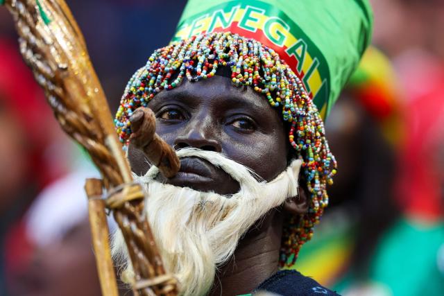A Senegal fan waits for the start of the Africa Cup of Nations (CAN) final football match between Senegal and Morocco at the Prince Moulay Abdellah Stadium in Rabat on January 18, 2026. (Photo by FRANCK FIFE / AFP)