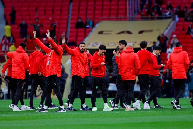 Morocco players gather on the field before the start of the Africa Cup of Nations (CAN) final football match between Senegal and Morocco at the Prince Moulay Abdellah Stadium in Rabat on January 18, 2026. (Photo by Abdel Majid BZIOUAT / AFP)