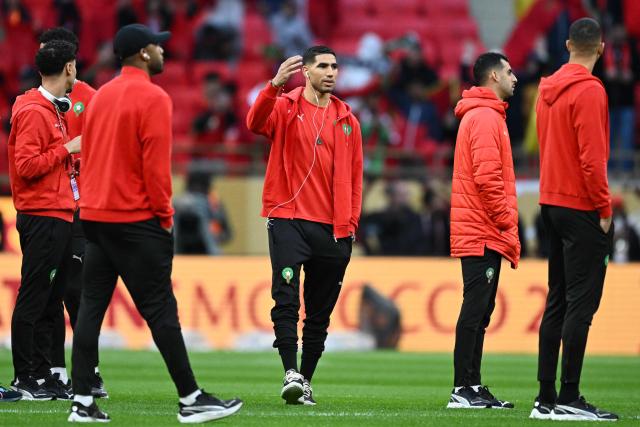 Morocco's defender #02 Achraf Hakimi arrives with teammates prior the Africa Cup of Nations (CAN) final football match between Senegal and Morocco at the Prince Moulay Abdellah Stadium in Rabat on January 18, 2026. (Photo by SEBASTIEN BOZON / AFP)