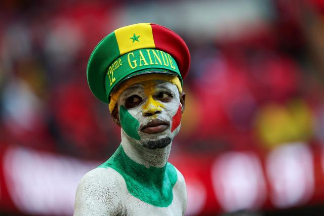 TOPSHOT - A Senegal fan waits for the start of the Africa Cup of Nations (CAN) final football match between Senegal and Morocco at the Prince Moulay Abdellah Stadium in Rabat on January 18, 2026. (Photo by FRANCK FIFE / AFP)