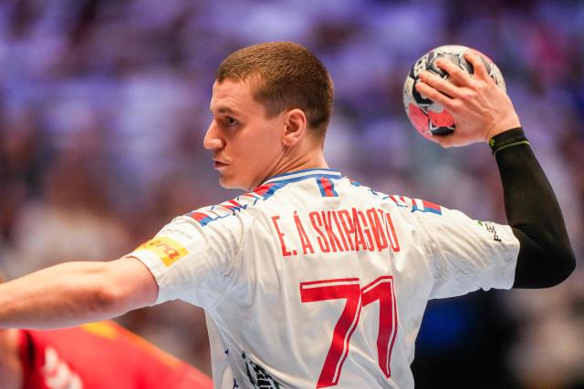 Faroes' centre back #71 Elias A Skipagotu throws the ball during the men's EHF Euro 2026 preliminary round handball match Montenegro vs Faroe Islands in Oslo, Norway, on January 18, 2026. (Photo by Cornelius Poppe / NTB / AFP) / Norway OUT