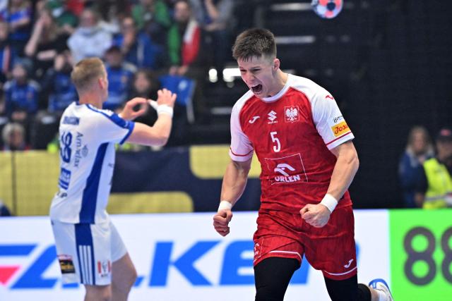 Poland's centre back #05 Michal Olejniczak (R) celebrates a goal during the men's EHF Euro 2026 preliminary round group F handball match Poland v Iceland in Kristianstad, Sweden, on January 18, 2026. (Photo by Johan Nilsson/TT / TT NEWS AGENCY / AFP) / Sweden OUT