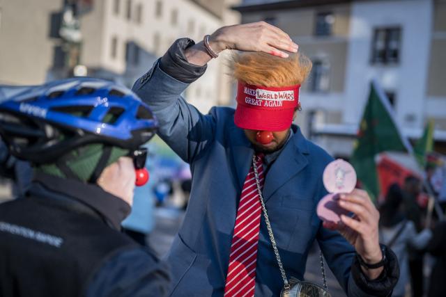Protesters take part in a demonstration against the World Economic Forum (WEF) on the eve of the WEF annual meeting in Davos on January 18, 2026. (Photo by Fabrice COFFRINI / AFP)