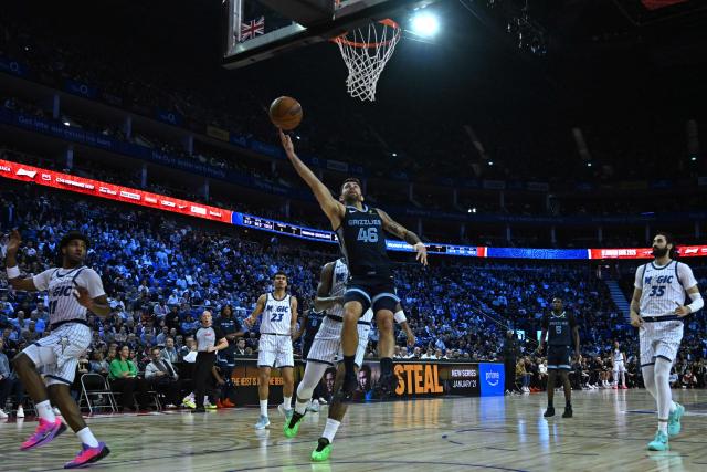 Memphis Grizzlies’ US shooting guard #46 John Konchar jumps at the basket during the 2025/2026 NBA season basketball match between the Memphis Grizzlies and Orlando Magic at the O2 Arena in London on January 18, 2026. (Photo by Glyn KIRK / AFP)