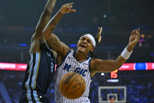 Memphis Grizzlies’ US power forward #08 Jaren Jackson Jr. (L) and Orlando Magic’s US power forward #05 Paolo Banchero (R) collide during the 2025/2026 NBA season basketball match between the Memphis Grizzlies and Orlando Magic at the O2 Arena in London on January 18, 2026. (Photo by Glyn KIRK / AFP)