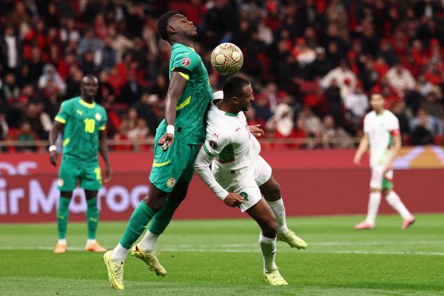 Morocco's forward #19 Youssef En-Nesyri (R) fights for the ball with Senegal's forward #20 Habib Diallo uring the Africa Cup of Nations (CAN) final football match between Senegal and Morocco at the Prince Moulay Abdellah Stadium in Rabat on January 18, 2026. (Photo by FRANCK FIFE / AFP)