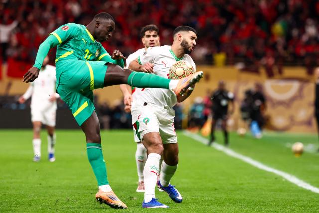 Morocco's midfielder #11 Ismael Saibari fights for the ball with Senegal's forward #20 Habib Diallo during the Africa Cup of Nations (CAN) final football match between Senegal and Morocco at the Prince Moulay Abdellah Stadium in Rabat on January 18, 2026. (Photo by FRANCK FIFE / AFP)