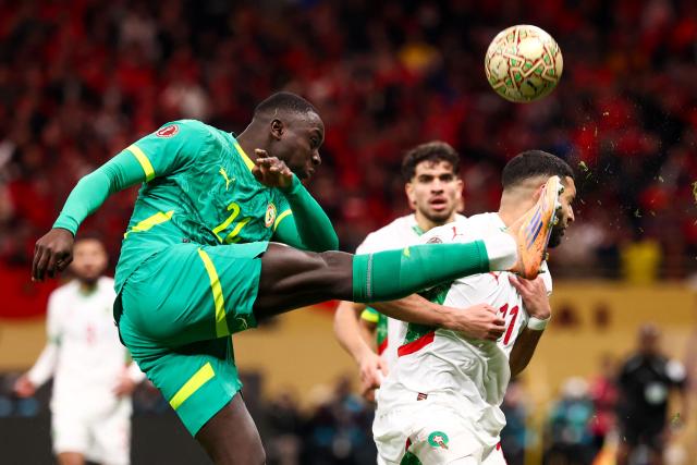 TOPSHOT - Morocco's midfielder #11 Ismael Saibari fights for the ball with Senegal's forward #20 Habib Diallo during the Africa Cup of Nations (CAN) final football match between Senegal and Morocco at the Prince Moulay Abdellah Stadium in Rabat on January 18, 2026. (Photo by FRANCK FIFE / AFP)