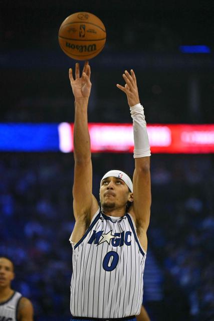 Orlando Magic’s US point guard #00 Anthony Black takes a free throw during the 2025/2026 NBA season basketball match between the Memphis Grizzlies and Orlando Magic at the O2 Arena in London on January 18, 2026. (Photo by Glyn KIRK / AFP)