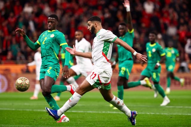 Morocco's midfielder #11 Ismael Saibari fights for the ball with Senegal's defender #02 Mamadou Sarr during the Africa Cup of Nations (CAN) final football match between Senegal and Morocco at the Prince Moulay Abdellah Stadium in Rabat on January 18, 2026. (Photo by FRANCK FIFE / AFP)