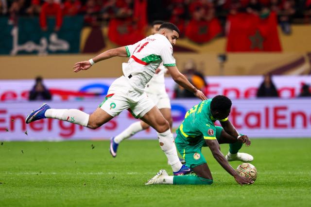 Morocco's midfielder #11 Ismael Saibari fights for the ball with Senegal's midfielder #08 Lamine Camara during the Africa Cup of Nations (CAN) final football match between Senegal and Morocco at the Prince Moulay Abdellah Stadium in Rabat on January 18, 2026. (Photo by FRANCK FIFE / AFP)