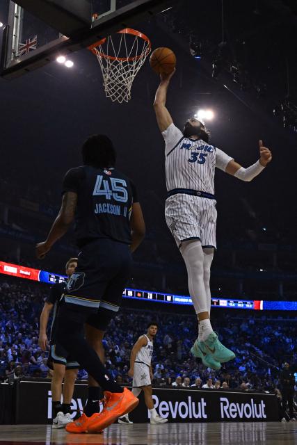 Orlando Magic’s Georgian center #35 Goga Bitadze jumps to score during the 2025/2026 NBA season basketball match between the Memphis Grizzlies and Orlando Magic at the O2 Arena in London on January 18, 2026. (Photo by Glyn KIRK / AFP)