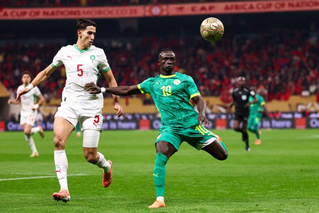 Senegal's forward #10 Sadio Mane fights for the ball with Morocco's defender #05 Nayef Aguerd during the Africa Cup of Nations (CAN) final football match between Senegal and Morocco at the Prince Moulay Abdellah Stadium in Rabat on January 18, 2026. (Photo by FRANCK FIFE / AFP)