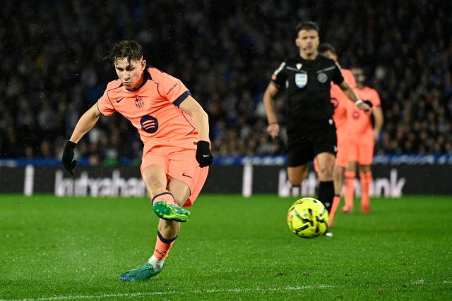 Barcelona's Spanish midfielder #16 Fermin Lopez scores a goal that was eventually disallowed during the Spanish league football match between Real Sociedad and FC Barcelona at Anoeta Stadium in San Sebastian on January 18, 2026. (Photo by ANDER GILLENEA / AFP)