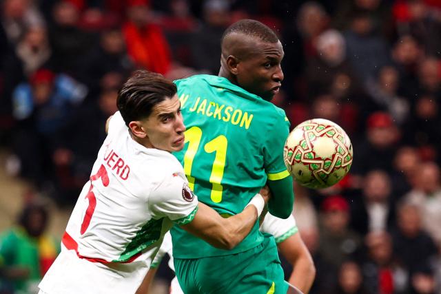 Morocco's defender #05 Nayef Aguerd and Senegal's forward #11 Nicolas Jackson fights for the ball during the Africa Cup of Nations (CAN) final football match between Senegal and Morocco at the Prince Moulay Abdellah Stadium in Rabat on January 18, 2026. (Photo by FRANCK FIFE / AFP)