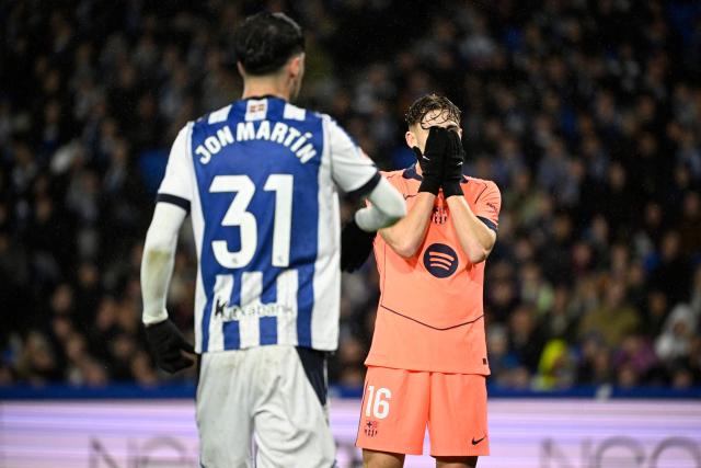 Barcelona's Spanish midfielder #16 Fermin Lopez reacts to missing a goal opportunity during the Spanish league football match between Real Sociedad and FC Barcelona at Anoeta Stadium in San Sebastian on January 18, 2026. (Photo by ANDER GILLENEA / AFP)
