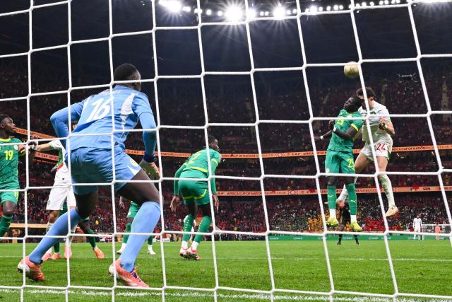 Senegal's defender #25 El Hadji Malick Diouf and Morocco's midfielder #24 Neil El Aynaoui vie during the Africa Cup of Nations (CAN) final football match between Senegal and Morocco at the Prince Moulay Abdellah Stadium in Rabat on January 18, 2026. (Photo by SEBASTIEN BOZON / AFP)