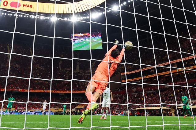 Morocco's goalkeeper #01 Yassine Bounou foils an attempt during the Africa Cup of Nations (CAN) final football match between Senegal and Morocco at the Prince Moulay Abdellah Stadium in Rabat on January 18, 2026. (Photo by FRANCK FIFE / AFP)