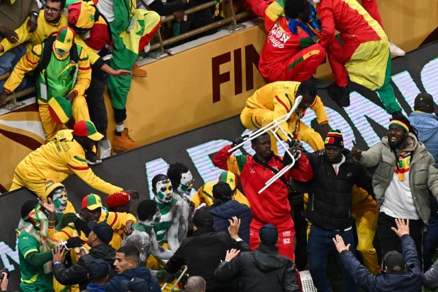Senegal supporters clash during the Africa Cup of Nations (CAN) final football match between Senegal and Morocco at the Prince Moulay Abdellah Stadium in Rabat on January 18, 2026. (Photo by Paul ELLIS / AFP)