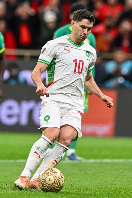 Morocco's forward #10 Brahim Diaz kicks the ball to miss a penalty during the Africa Cup of Nations (CAN) final football match between Senegal and Morocco at the Prince Moulay Abdellah Stadium in Rabat on January 18, 2026. (Photo by SEBASTIEN BOZON / AFP)