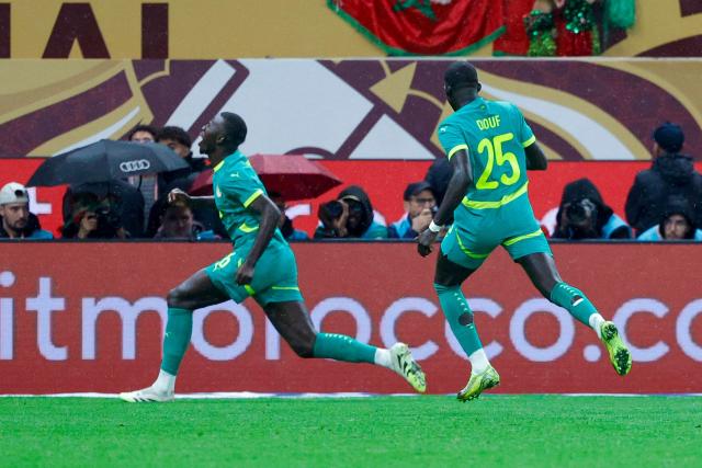 TOPSHOT - Senegal's midfielder #26 Pape Gueye celebrates scoring his team's first goal during the Africa Cup of Nations (CAN) final football match between Senegal and Morocco at the Prince Moulay Abdellah Stadium in Rabat on January 18, 2026. (Photo by Abdel Majid BZIOUAT / AFP)