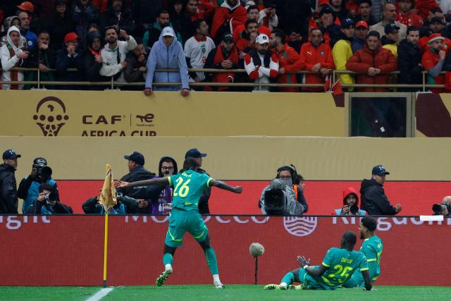 Senegal's midfielder #26 Pape Gueye celebrates scoring his team's first goal during the Africa Cup of Nations (CAN) final football match between Senegal and Morocco at the Prince Moulay Abdellah Stadium in Rabat on January 18, 2026. (Photo by Abdel Majid BZIOUAT / AFP)