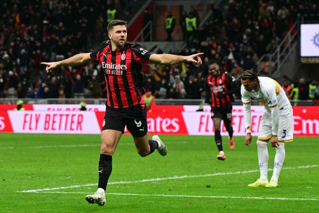 AC Milan's German forward #09 Niclas Fullkrug celebrates scoring his team's first goal during the Italian Serie A football match between AC Milan and Lecce at San Siro stadium in Milan, northern Italy, on January 18, 2026. (Photo by Stefano RELLANDINI / AFP)
