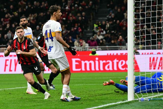 AC Milan's German forward #09 Niclas Fullkrug celebrates scoring his team's first goal during the Italian Serie A football match between AC Milan and Lecce at San Siro stadium in Milan, northern Italy, on January 18, 2026. (Photo by Stefano RELLANDINI / AFP)
