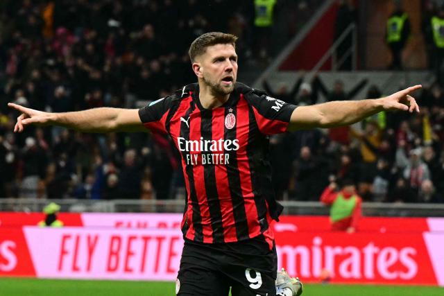 AC Milan's German forward #09 Niclas Fullkrug celebrates scoring his team's first goal during the Italian Serie A football match between AC Milan and Lecce at San Siro stadium in Milan, northern Italy, on January 18, 2026. (Photo by Stefano RELLANDINI / AFP)